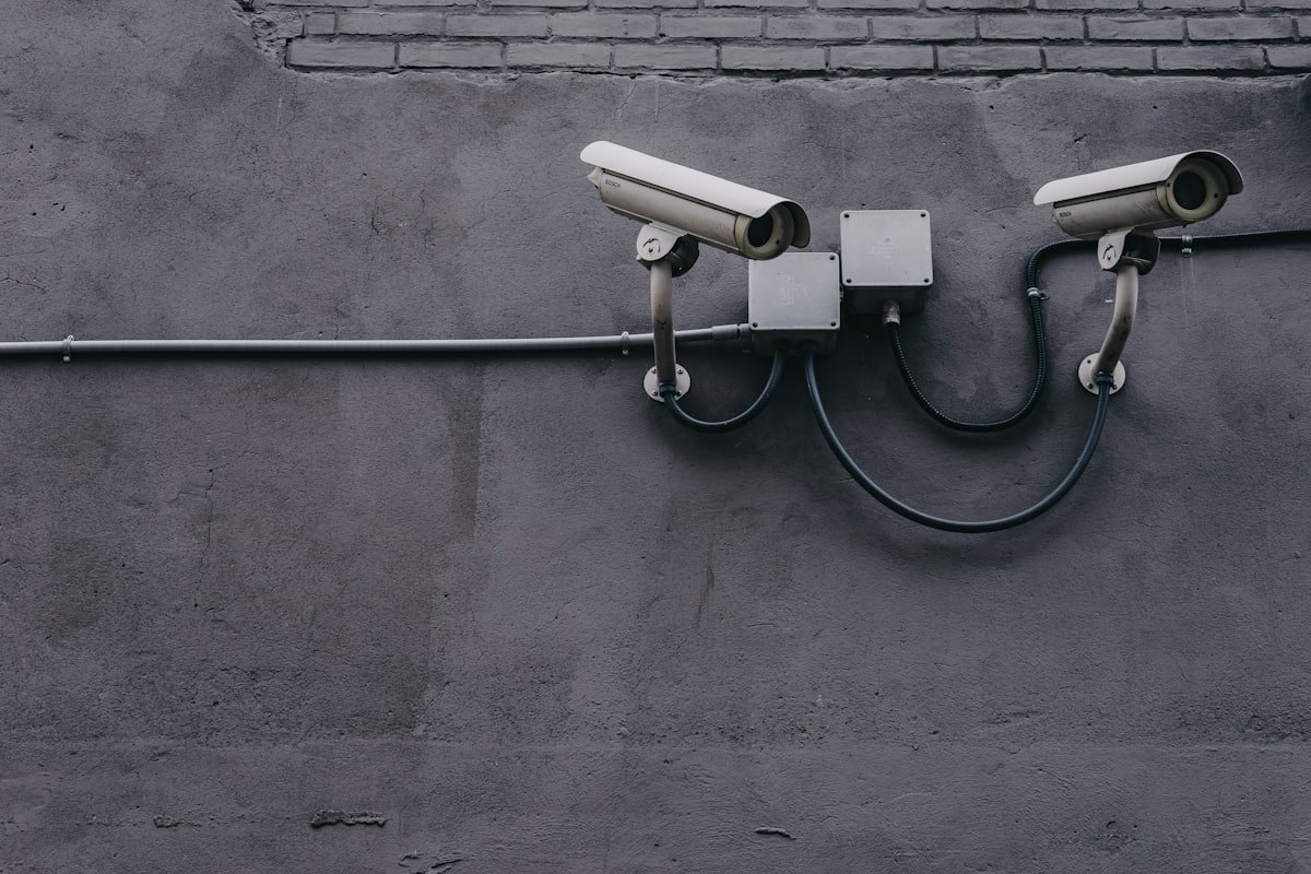 Pair of bullet cameras installed on a grey wall